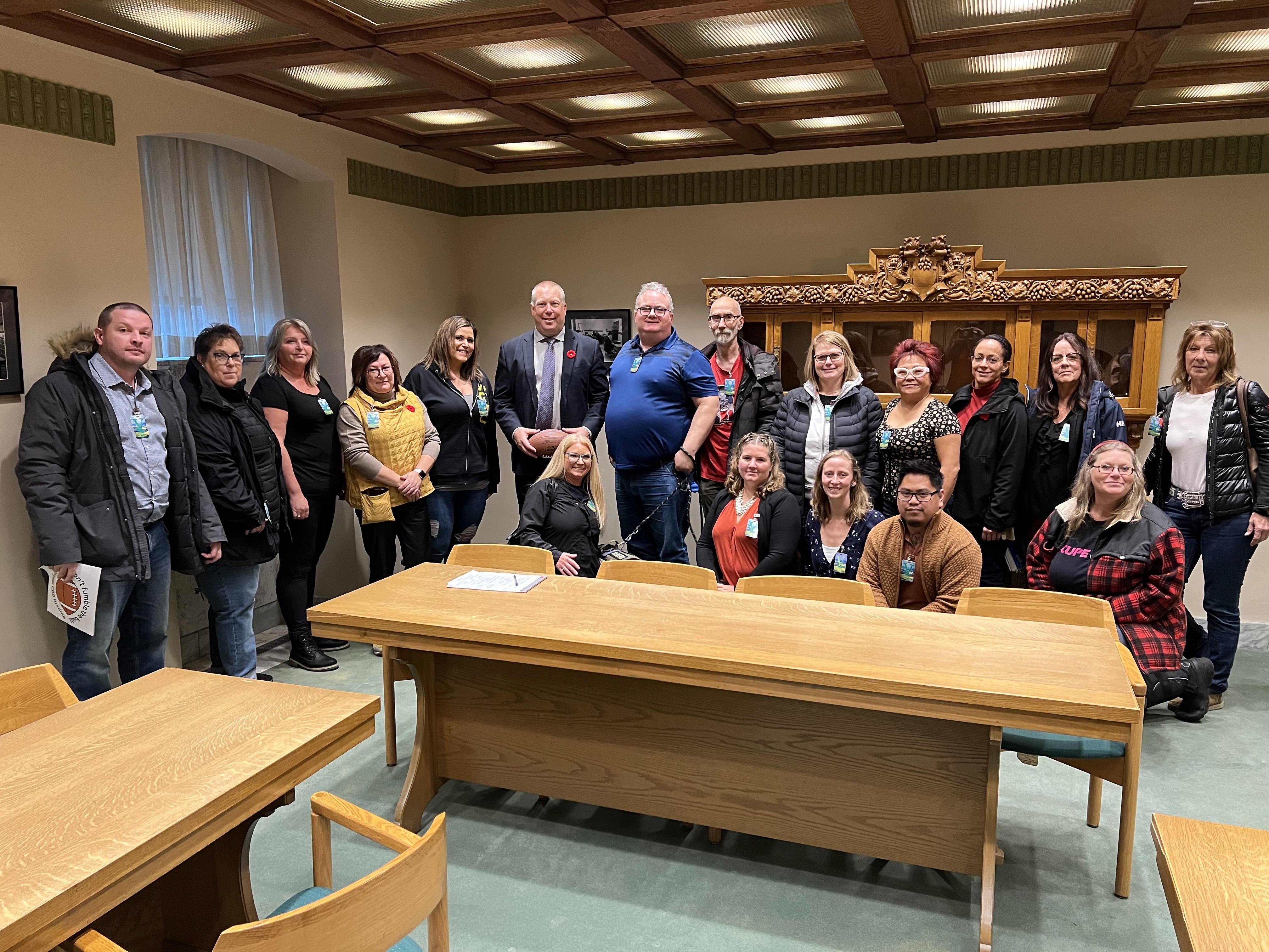 A group of union members meet with a government minister.