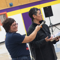 Tracey Sauer and Hali Topinka read a story to children at Ducharme Elementary School